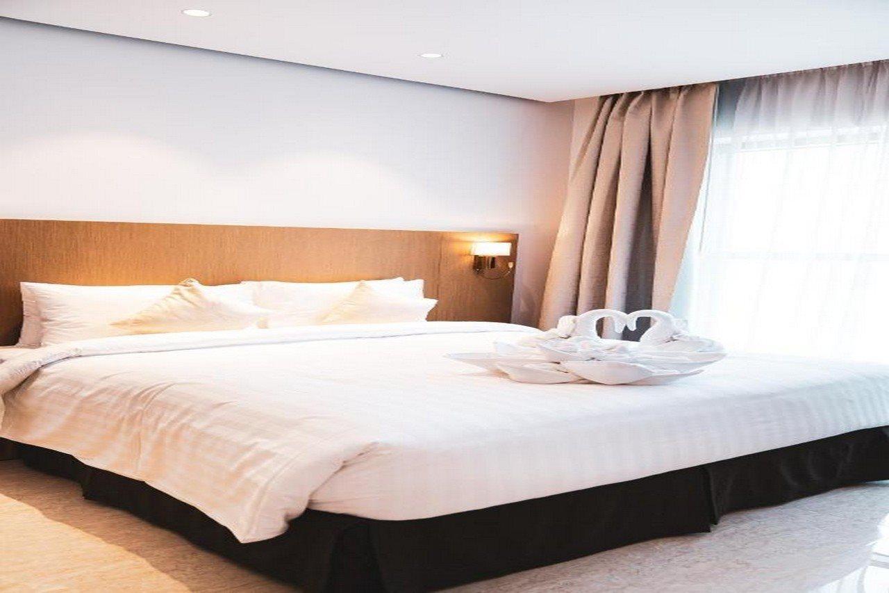 He Hotel Apartments 迪拜 外观 照片 A bed